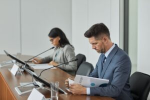 Professional People Looking through Documents 